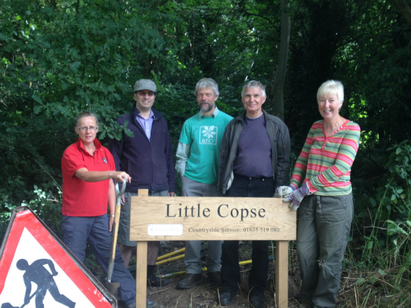 The volunteers and their sign